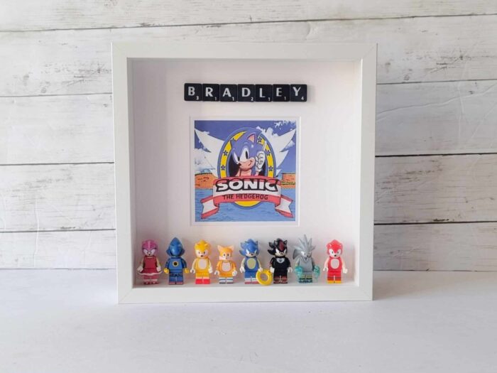 personalised Lego Sonic the hedgehog frame with minifigures and name in black scrabble tiles. 25x25cm white frame.